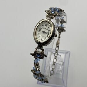 Elegant Geneva Women's Silver-Tone Watch with Blue Accents New Battery